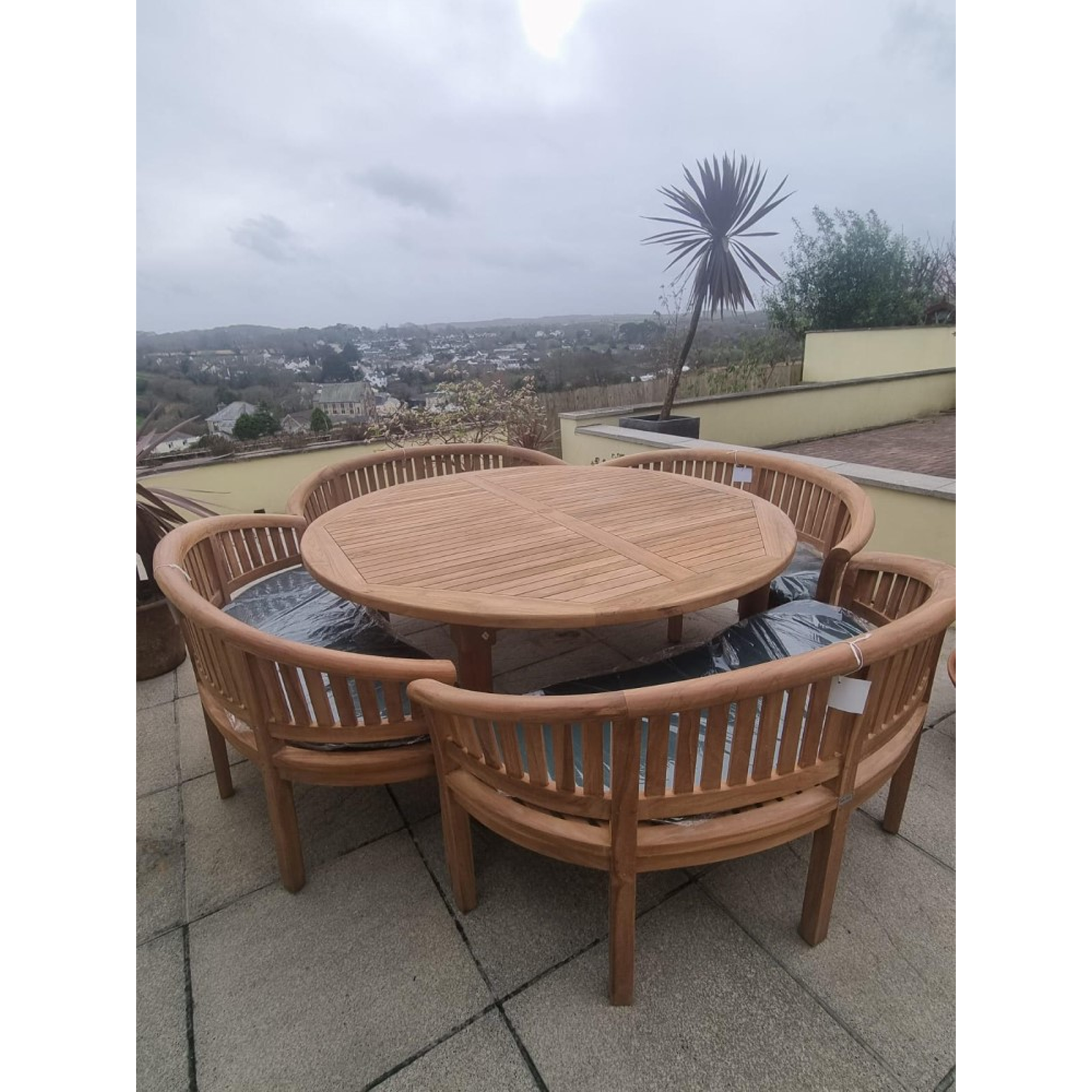 Teak garden dining set. 1.8m “Titan” round table, 4 bowwood style seats